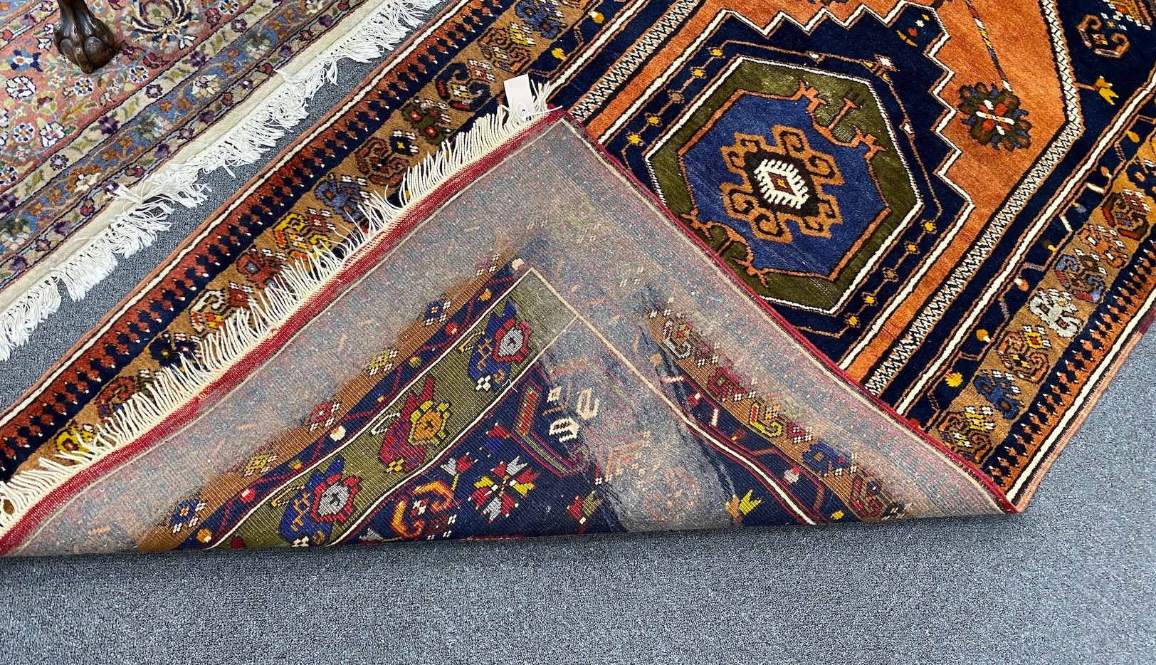 A Caucasian design blue ground rug, 204 x 104cm